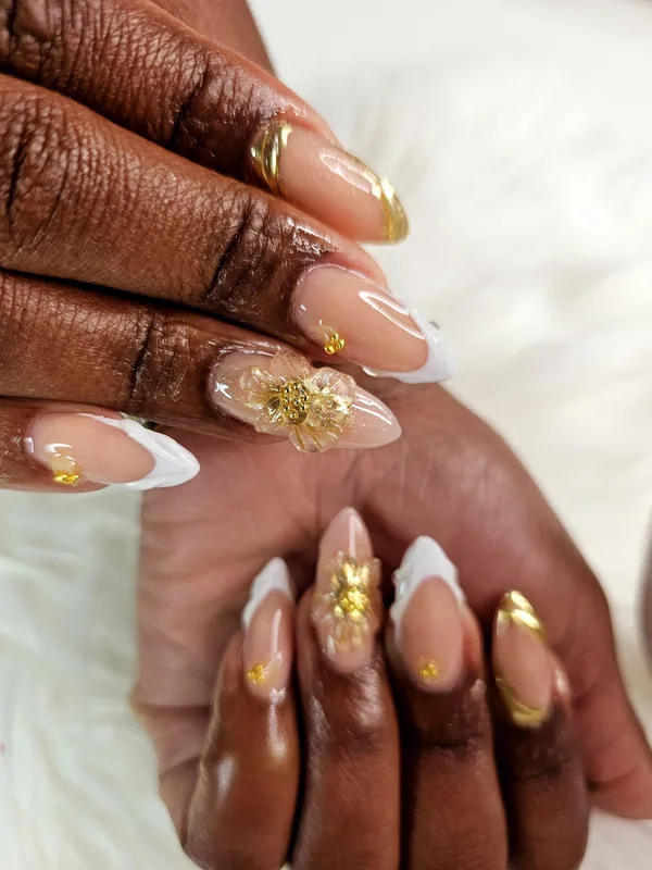Gold foil French tips on almond nails